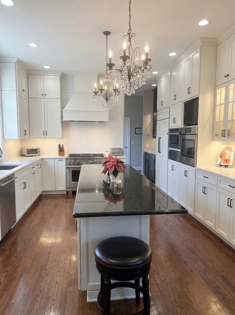 White kitchen cabinets and marble countertops.