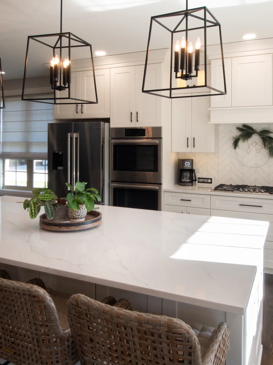 Elegant kitchen with modern appliances and white cabinets.