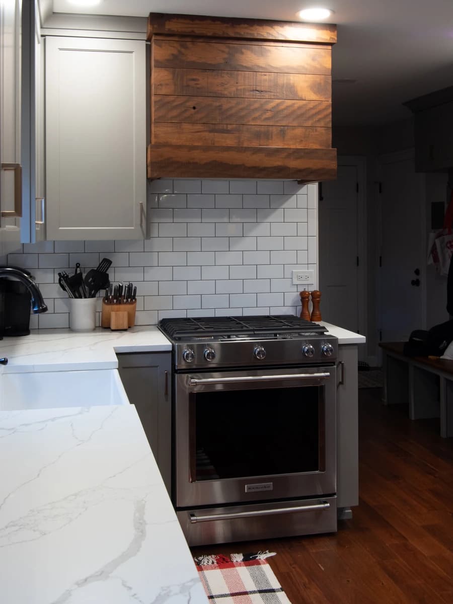 Kitchen with a stainless steel oven and marble countertops.