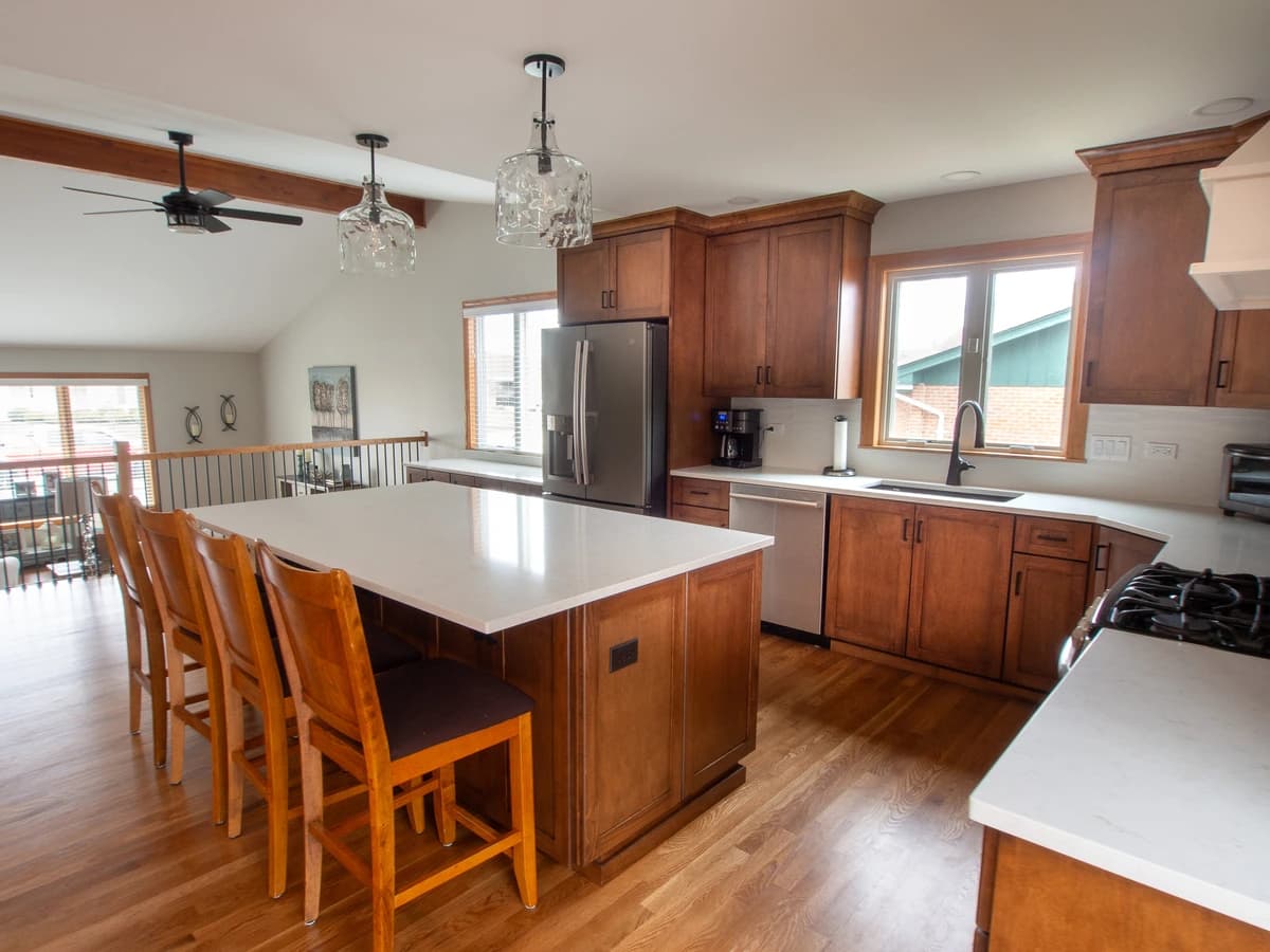 Spacious kitchen with a modern design featuring granite countertops and stainless steel appliances.