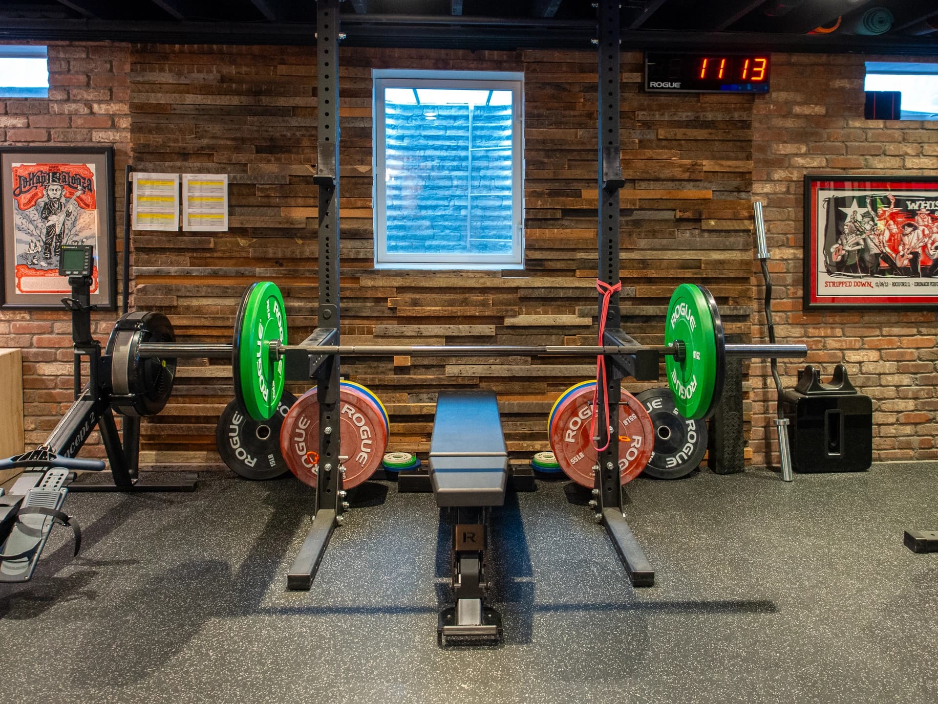 Home gym with weightlifting equipment.