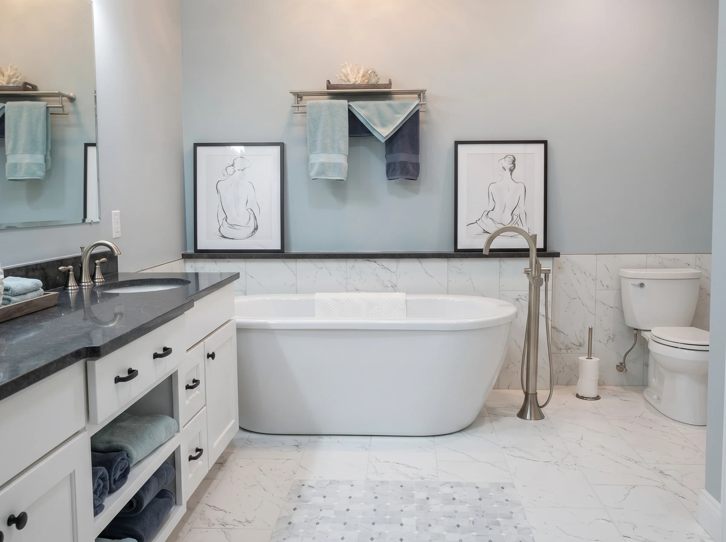 Modern bathroom with a marble countertop and blue walls.