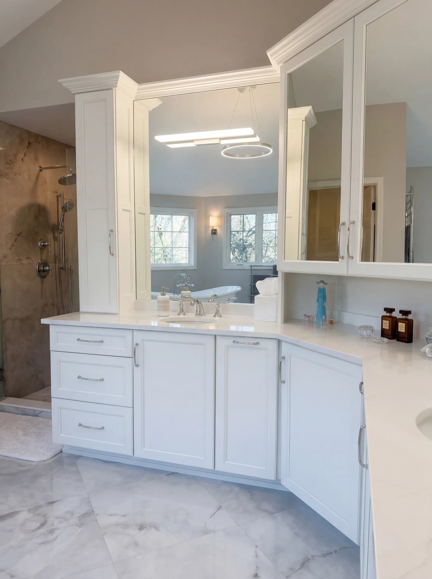 Luxurious bathroom with large vanity mirror and marble countertops.