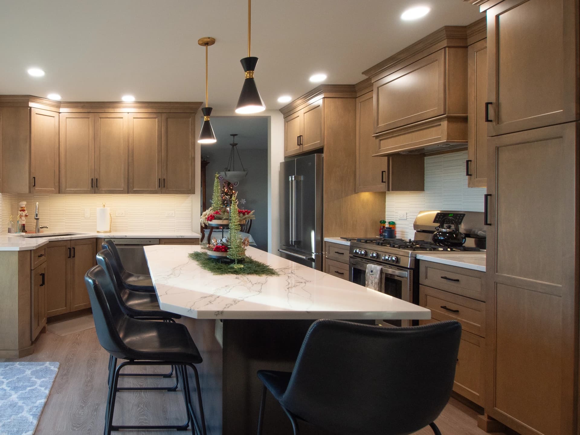 Modern kitchen with a contemporary island and wooden cabinets.