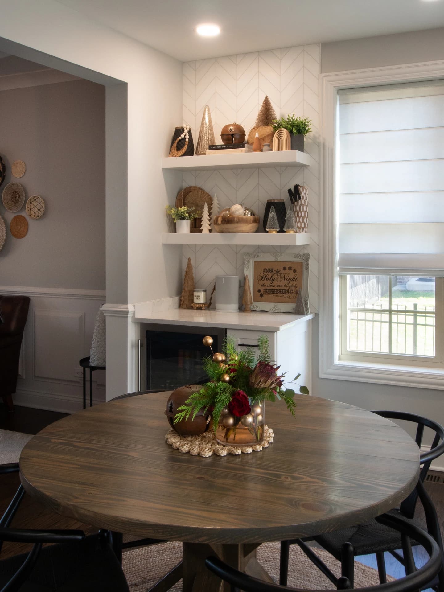 Rustic farmhouse interior, wooden table and chairs, neutral color palette.