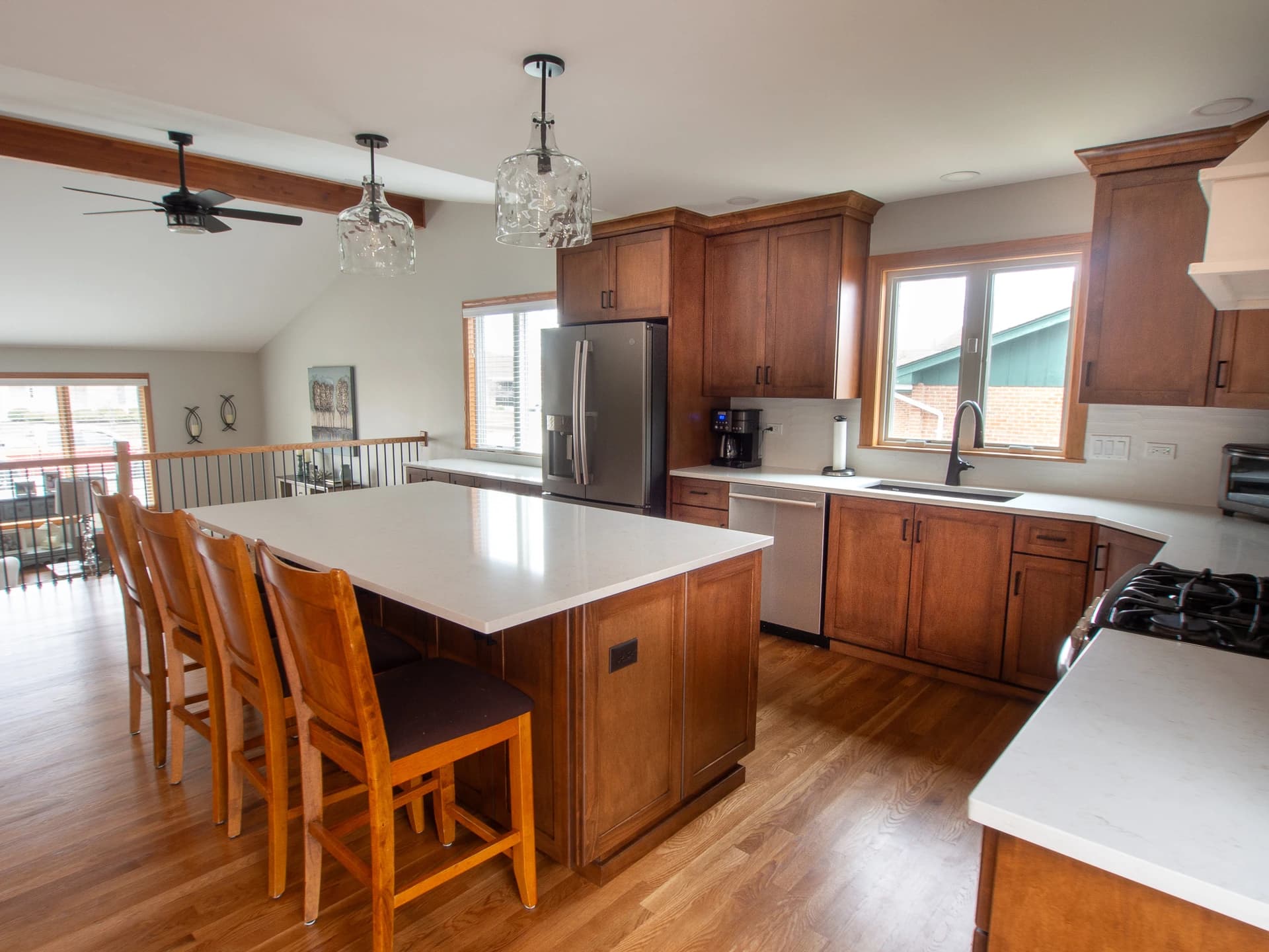Spacious kitchen with a modern design featuring granite countertops and stainless steel appliances.