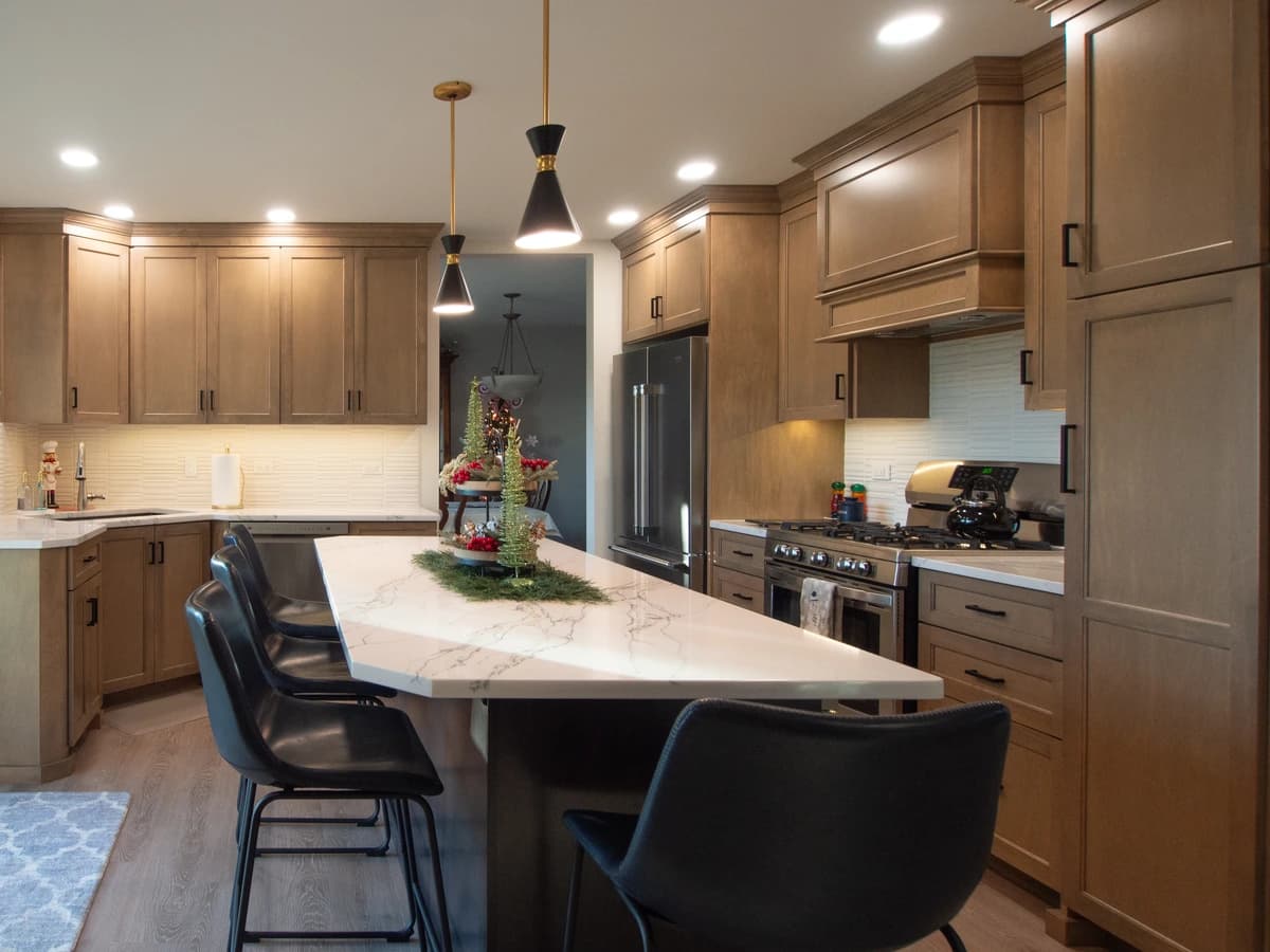 Modern kitchen with a contemporary island and wooden cabinets.